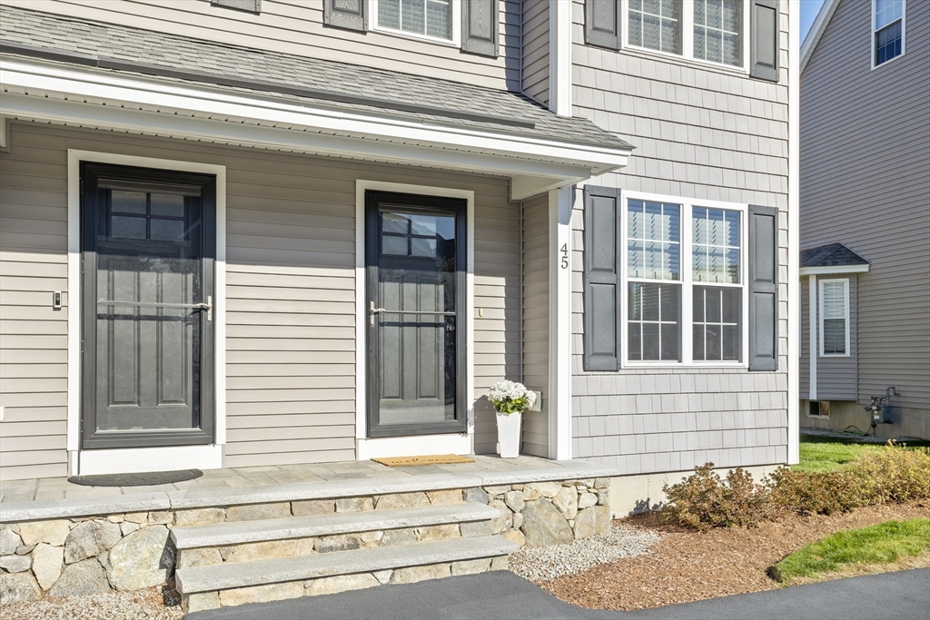 45 Riley Road, Unit 45 Tyngsborough, MA 01879 - Photo 3 of 42 a front view of a house