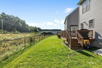 45 Riley Road, Unit 45 Tyngsborough, MA 01879 - Photo 35 of 42 a view of a garden with lawn chairs