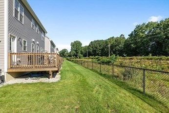 45 Riley Road, Unit 45 Tyngsborough, MA 01879 - Photo 37 of 42 a view of a house with a yard