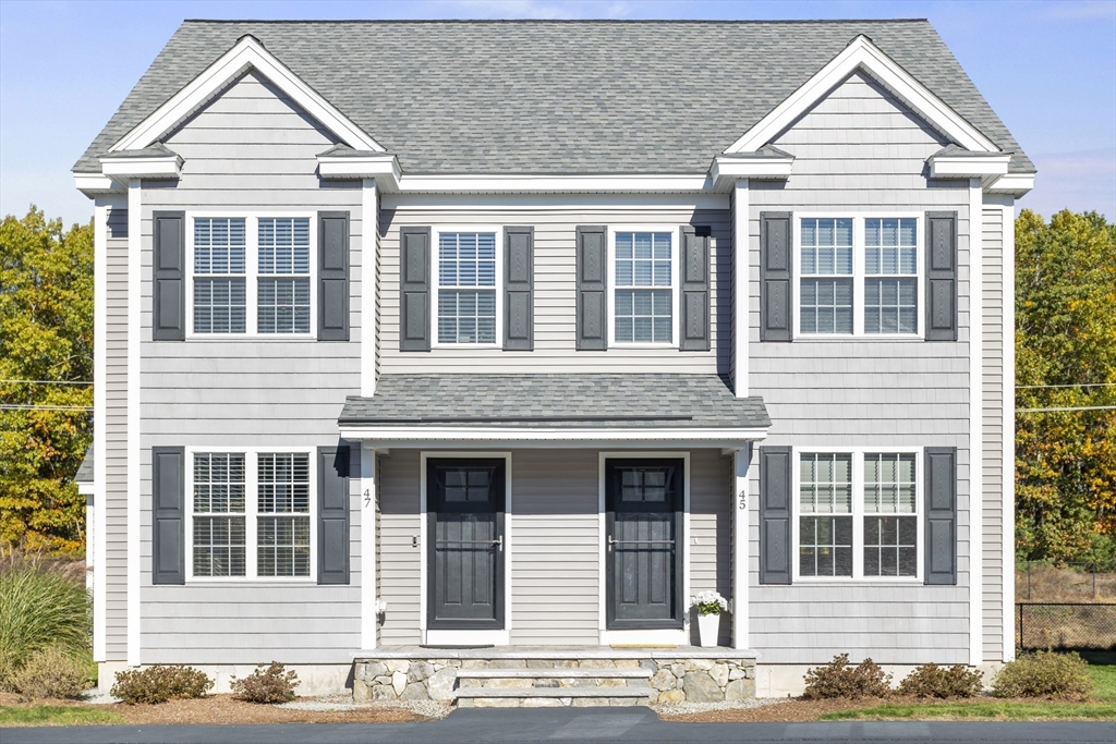45 Riley Road, Unit 45 Tyngsborough, MA 01879 - Photo 38 of 42 a view of a brick house with windows