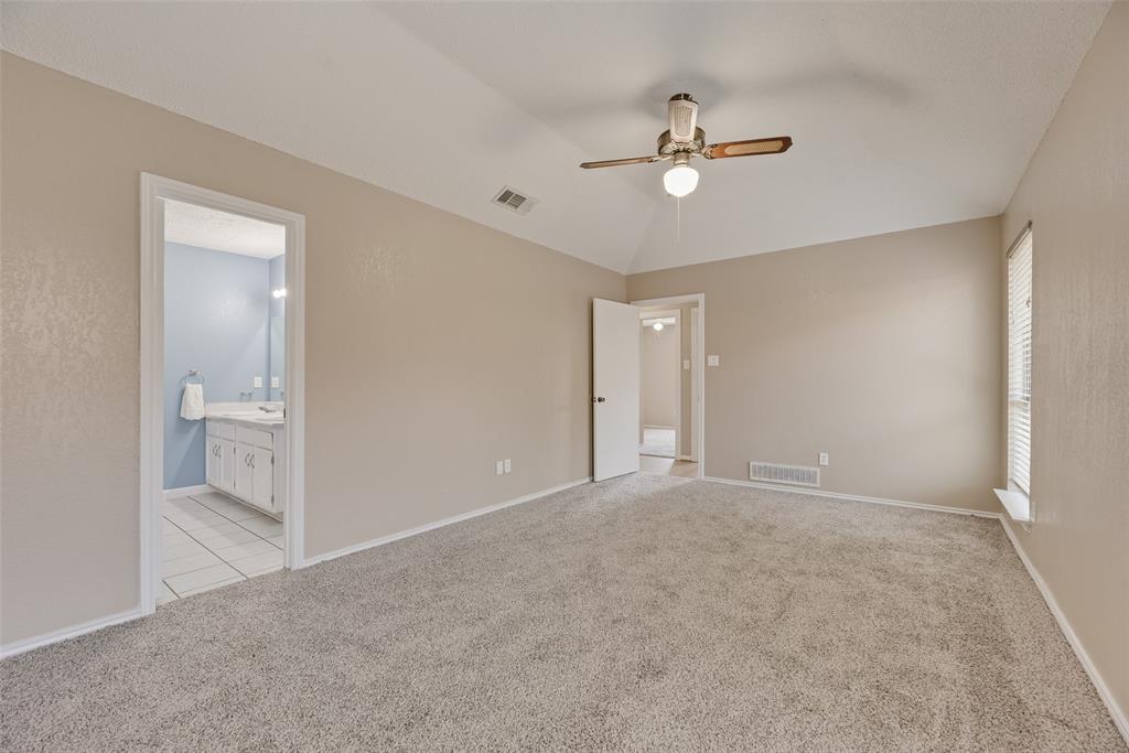 7805 Swiss Way Rowlett, TX 75089 - Photo 19 of 32 a view of a room with a ceiling fan and bathroom