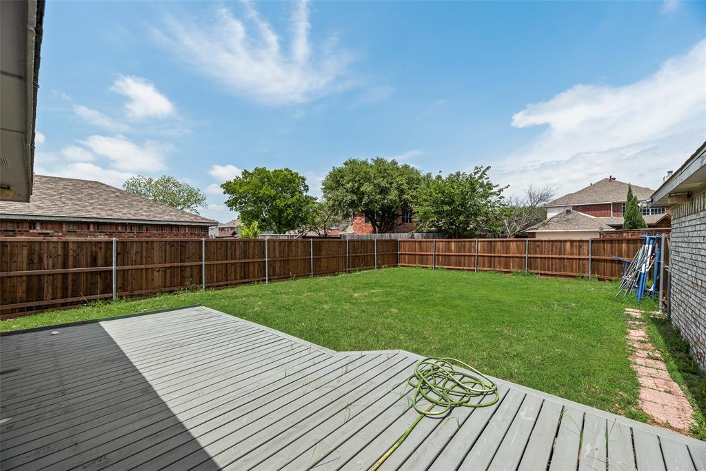 7805 Swiss Way Rowlett, TX 75089 - Photo 29 of 32 a view of a backyard with wooden floor