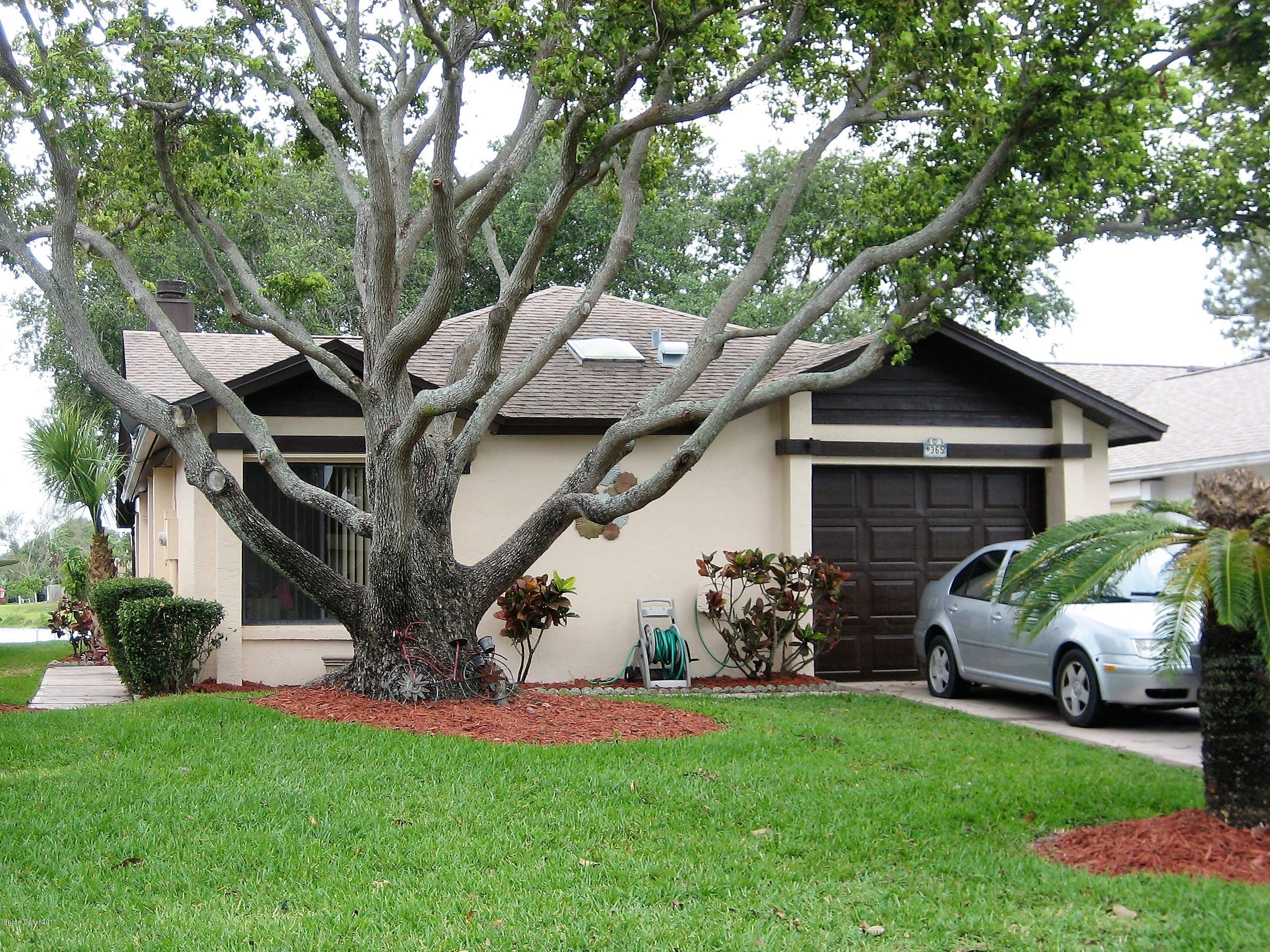 365 Myrtlewood Road Melbourne, FL 32940 - Photo 1 of 8 a front view of a house with a garden