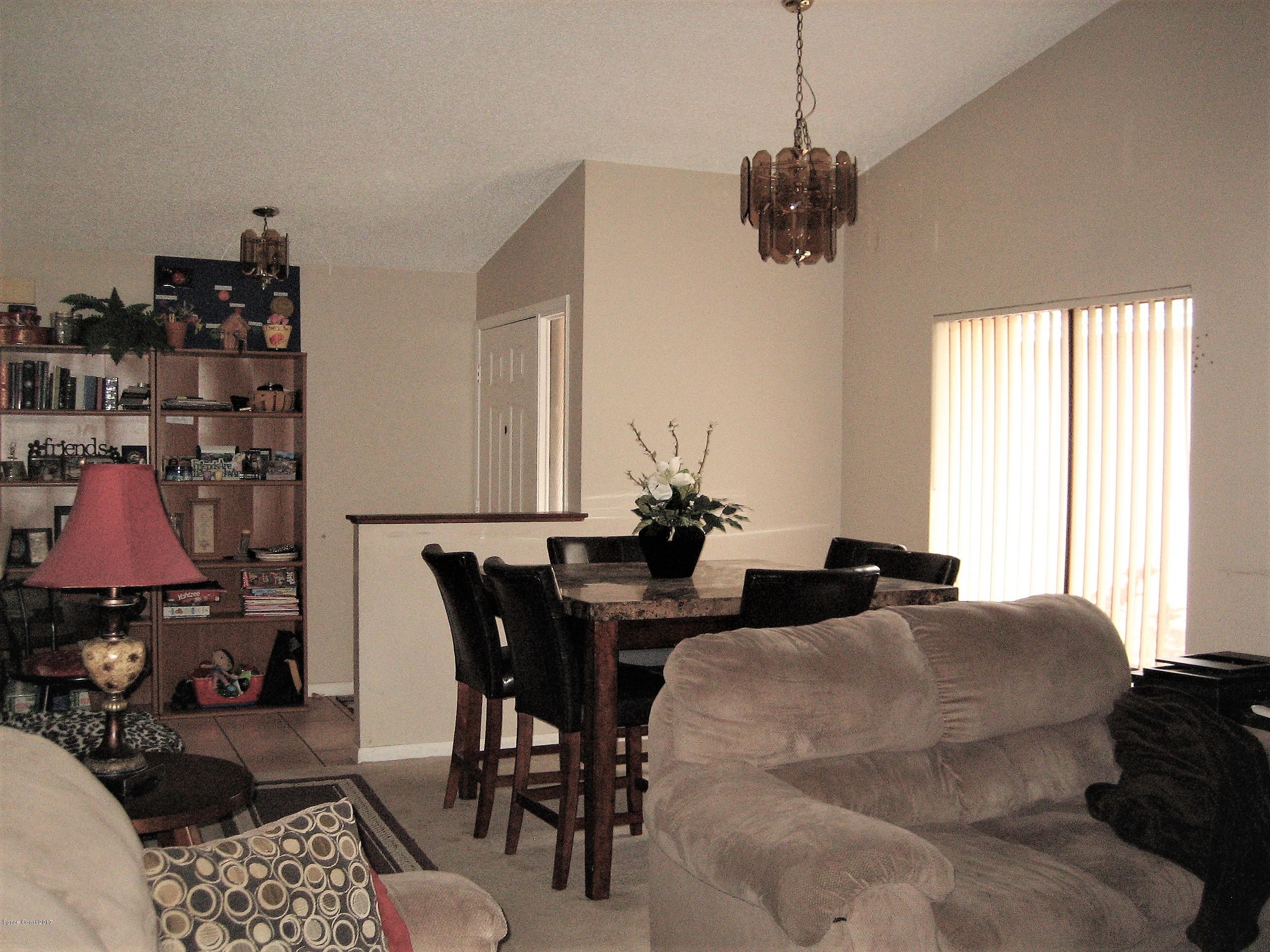 365 Myrtlewood Road Melbourne, FL 32940 - Photo 5 of 8 a living room with furniture and a window