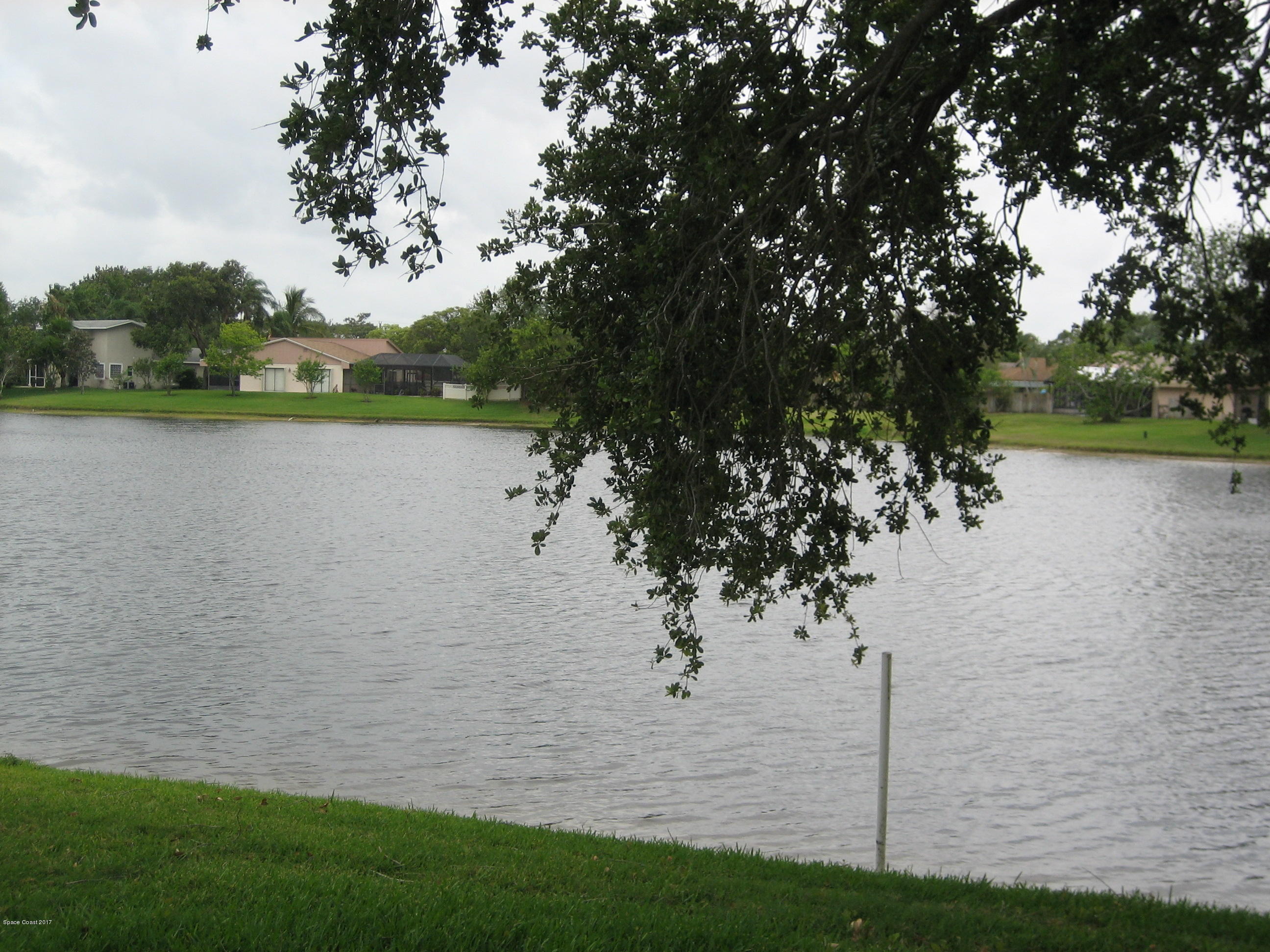 365 Myrtlewood Road Melbourne, FL 32940 - Photo 7 of 8 a view of lake with green space