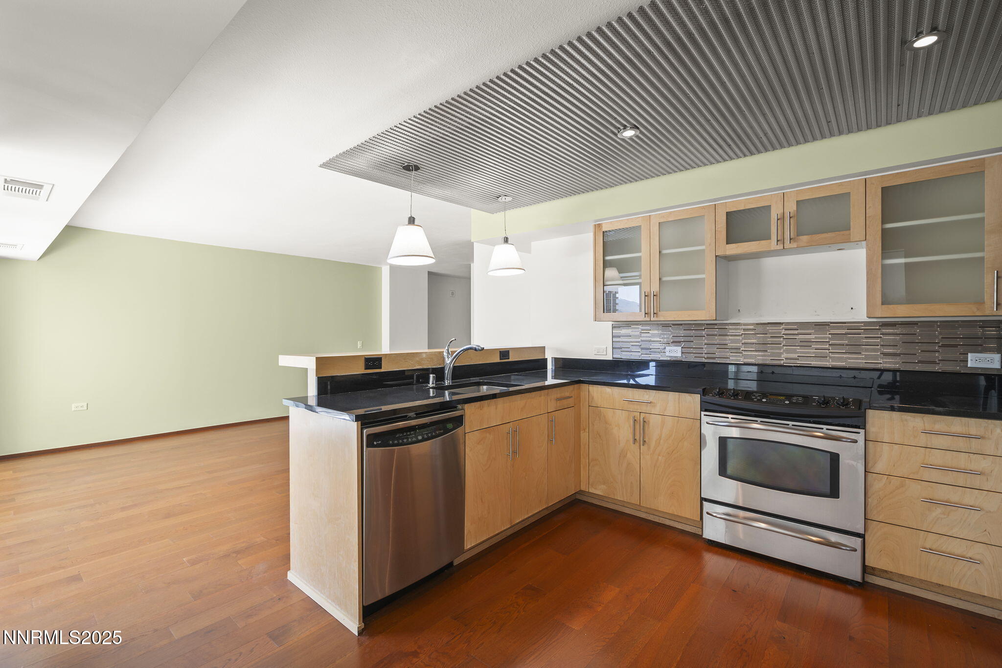 255 North Sierra Street, Unit 1419 Reno, NV 89501 - Photo 13 of 40 a kitchen with stainless steel appliances granite countertop a stove and a sink