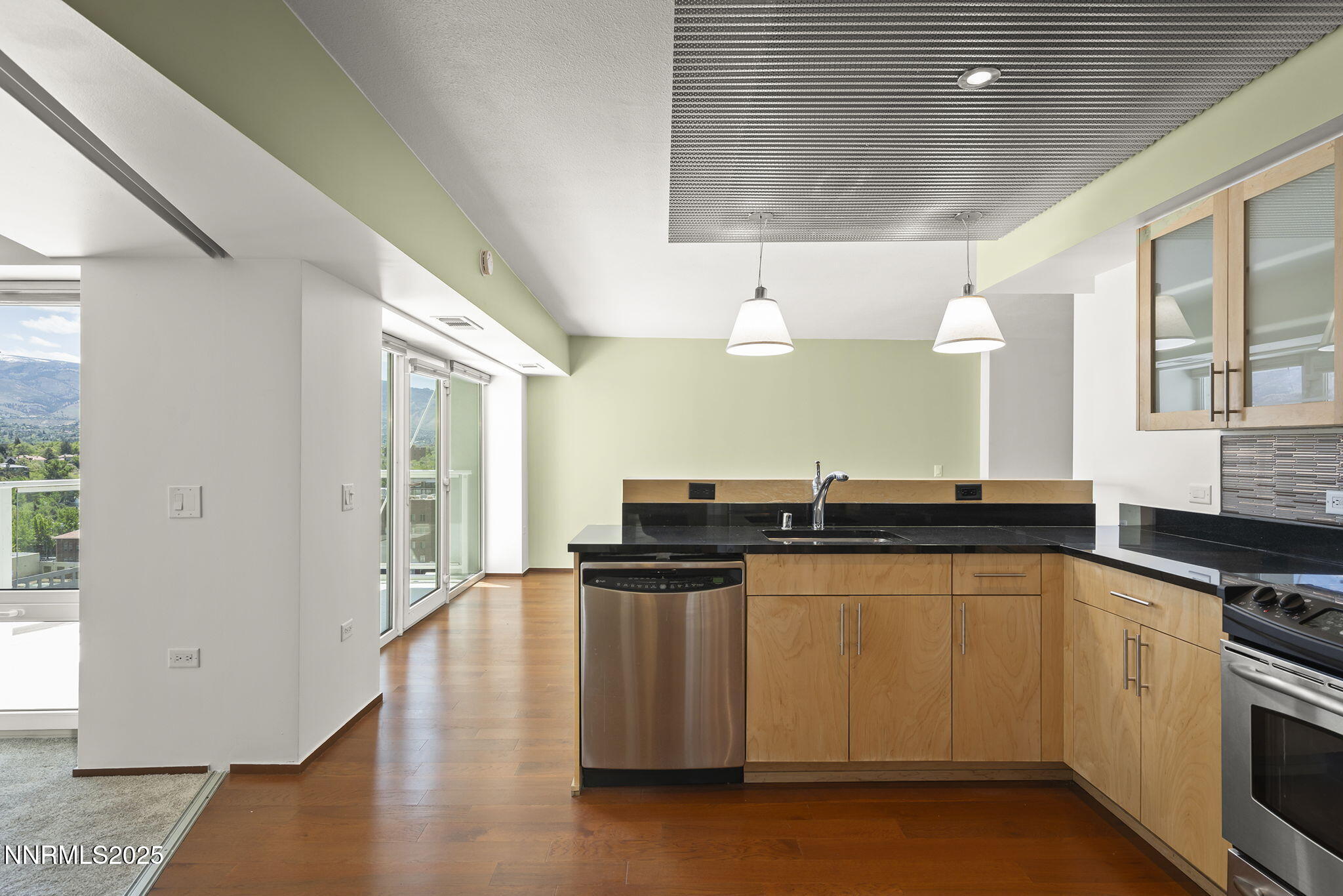 255 North Sierra Street, Unit 1419 Reno, NV 89501 - Photo 14 of 40 a kitchen with stainless steel appliances granite countertop a stove and a sink