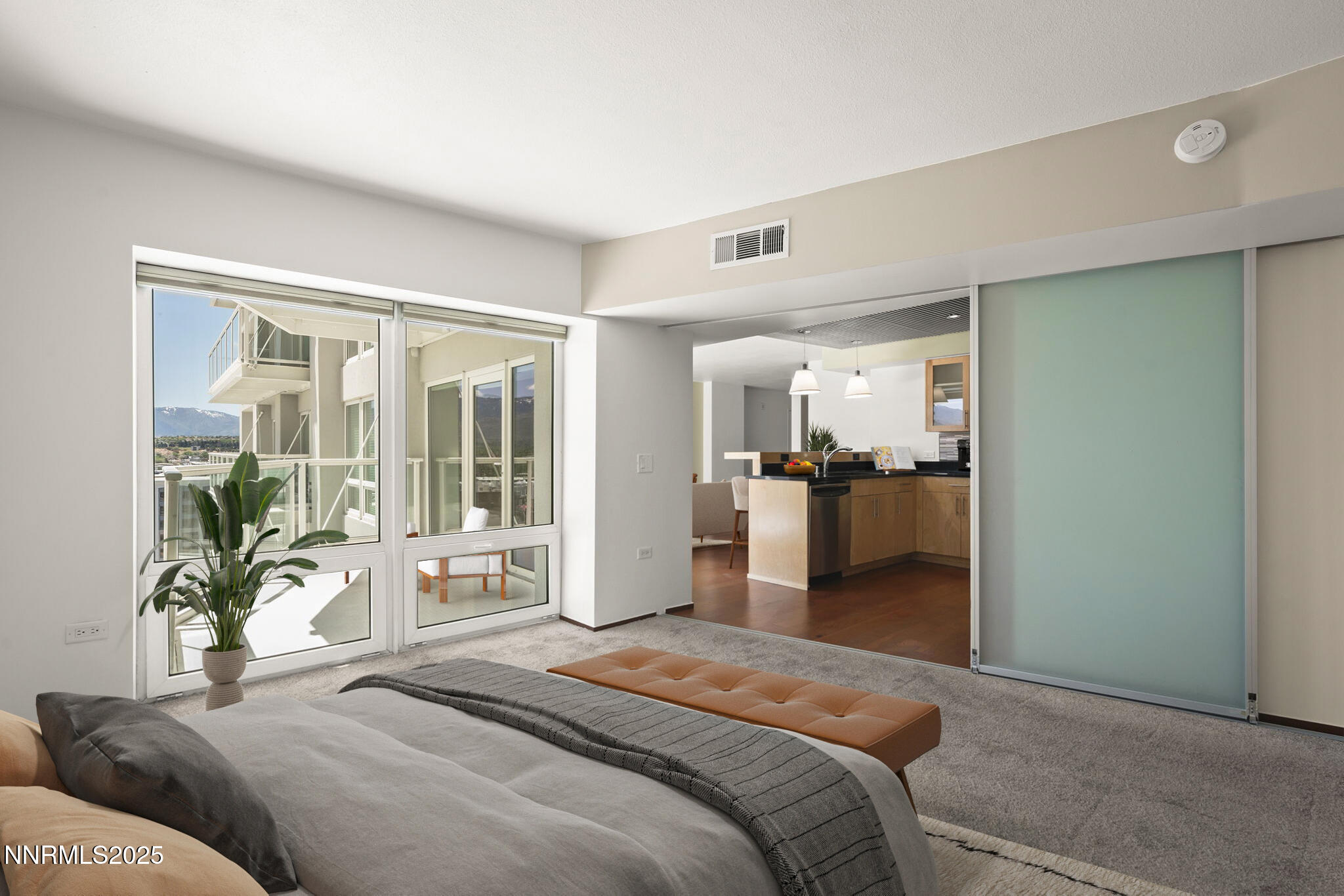 255 North Sierra Street, Unit 1419 Reno, NV 89501 - Photo 20 of 40 a bedroom with a bed and a large window