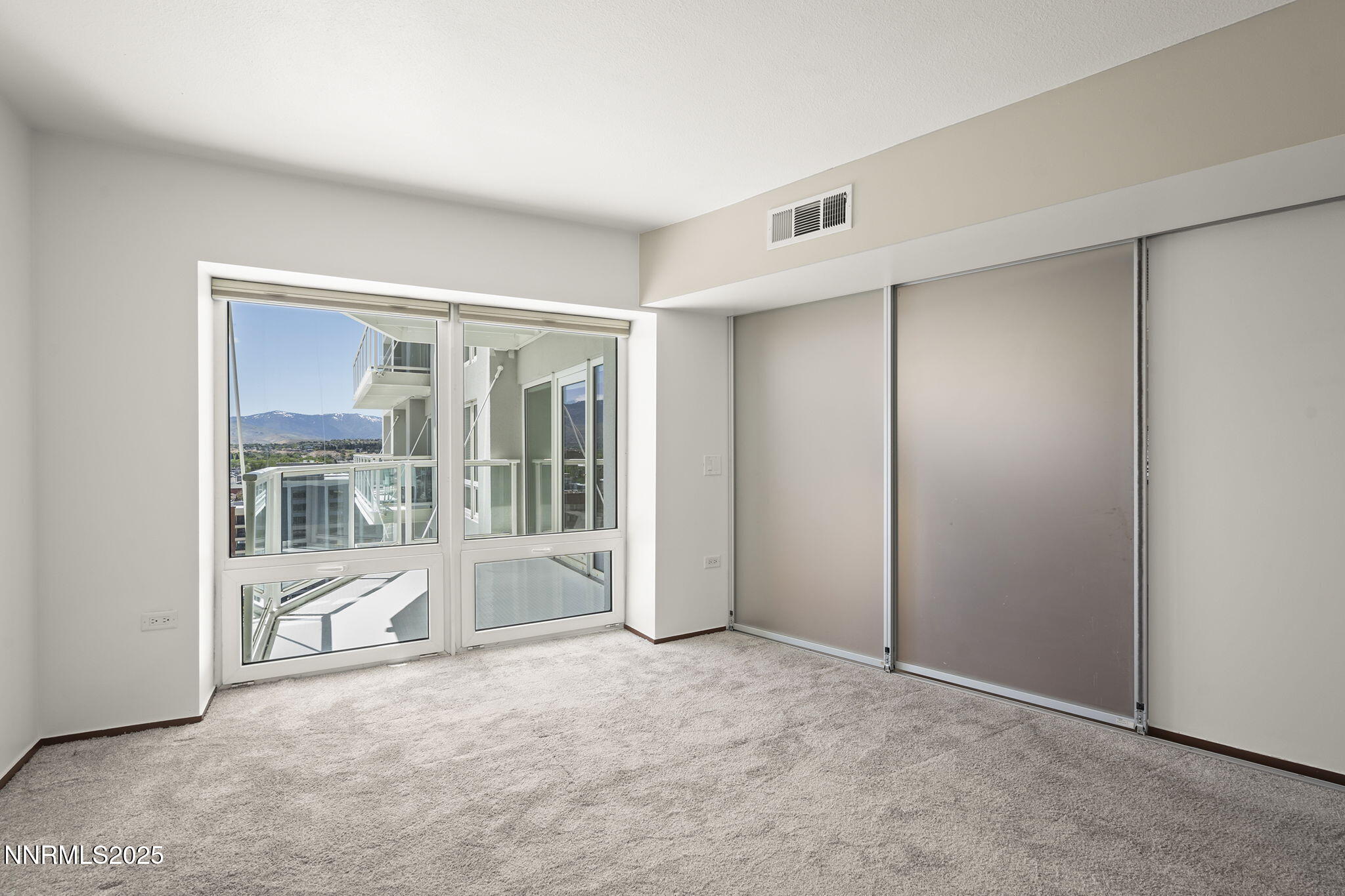 255 North Sierra Street, Unit 1419 Reno, NV 89501 - Photo 22 of 40 a view of an empty room with a fireplace