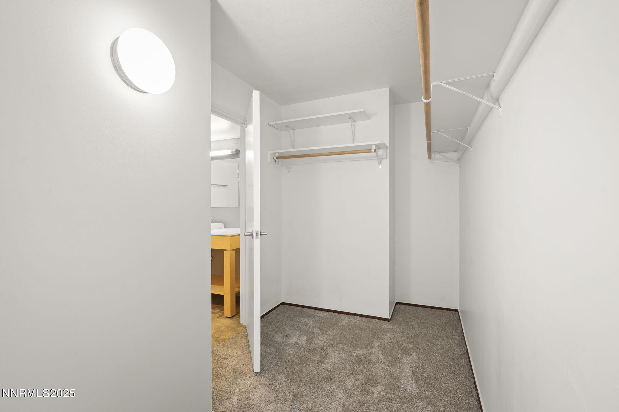 255 North Sierra Street, Unit 1419 Reno, NV 89501 - Photo 25 of 40 a view of an empty room with wooden floor and a window