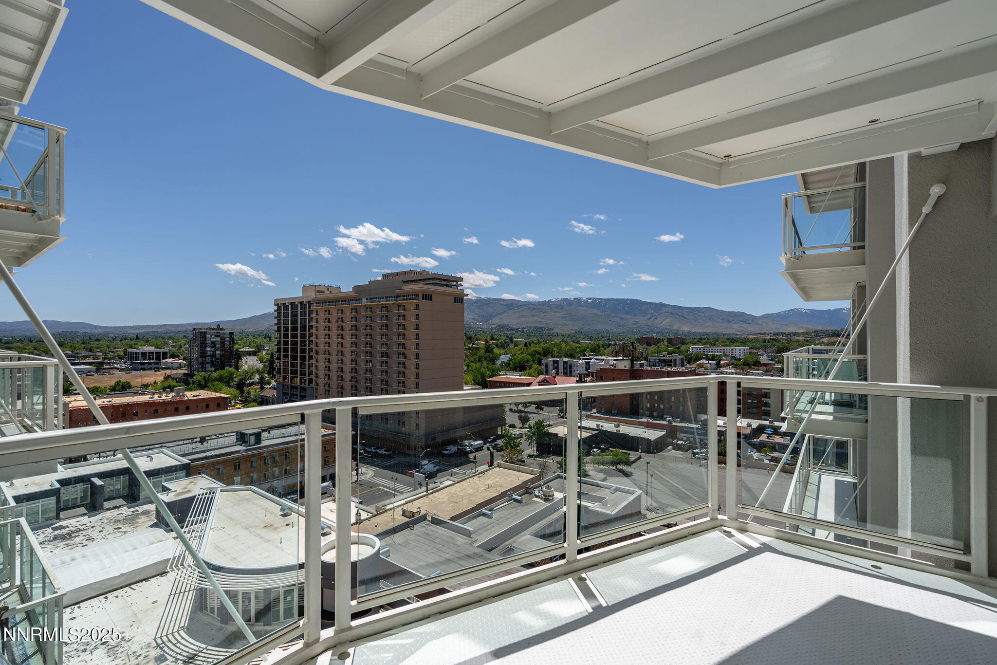 255 North Sierra Street, Unit 1419 Reno, NV 89501 - Photo 28 of 40 a view of a patio with a table and chairs