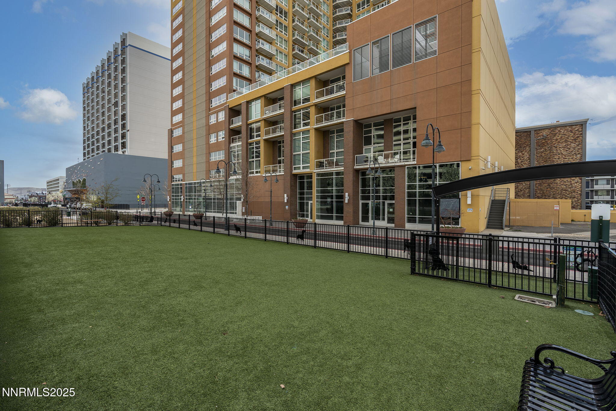 255 North Sierra Street, Unit 1419 Reno, NV 89501 - Photo 37 of 40 a view of a building with a backyard