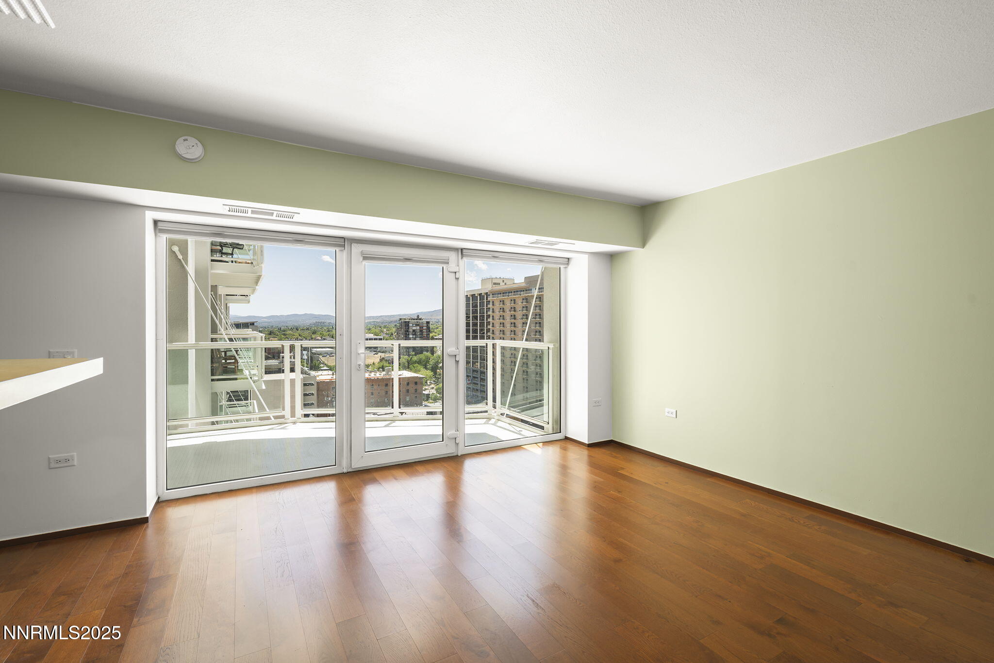 255 North Sierra Street, Unit 1419 Reno, NV 89501 - Photo 5 of 40 wooden floor in an empty room with a window