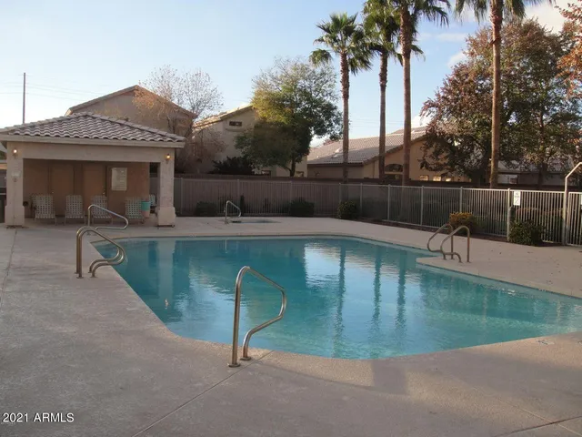 a view of a swimming pool with a patio