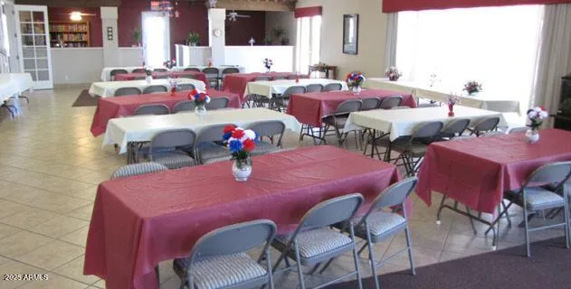 a view of a dining room with furniture and chandelier