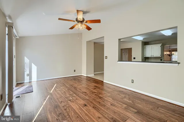 a view of a kitchen from the hallway