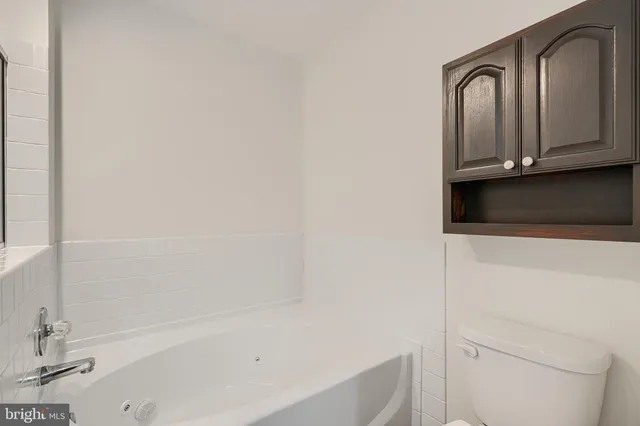 a bathroom with a bathtub and a sink