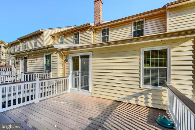 a front view of a house with large windows