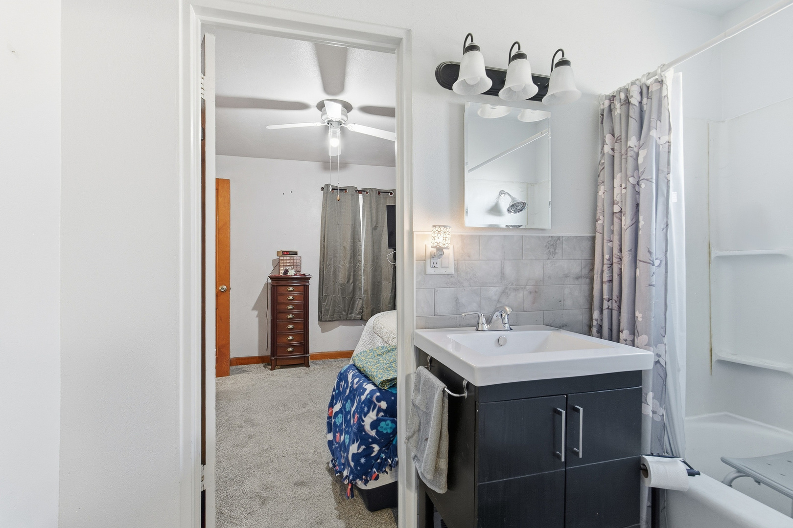 2400 47th Street Moline, IL 61265 - Photo 11 of 23 a bathroom with a sink and a mirror