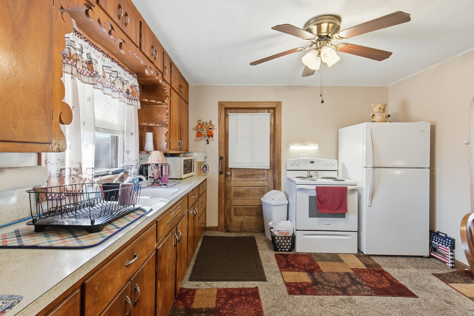2400 47th Street Moline, IL 61265 - Photo 15 of 23 a kitchen with a sink appliances and a counter top space
