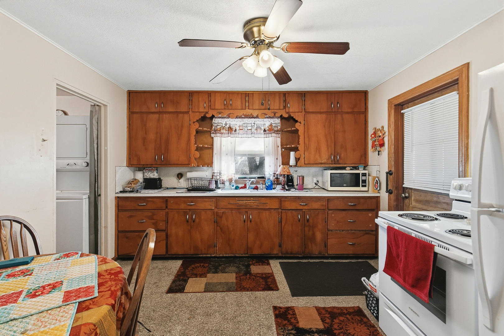 2400 47th Street Moline, IL 61265 - Photo 16 of 23 a kitchen with stainless steel appliances granite countertop a stove a sink and a refrigerator