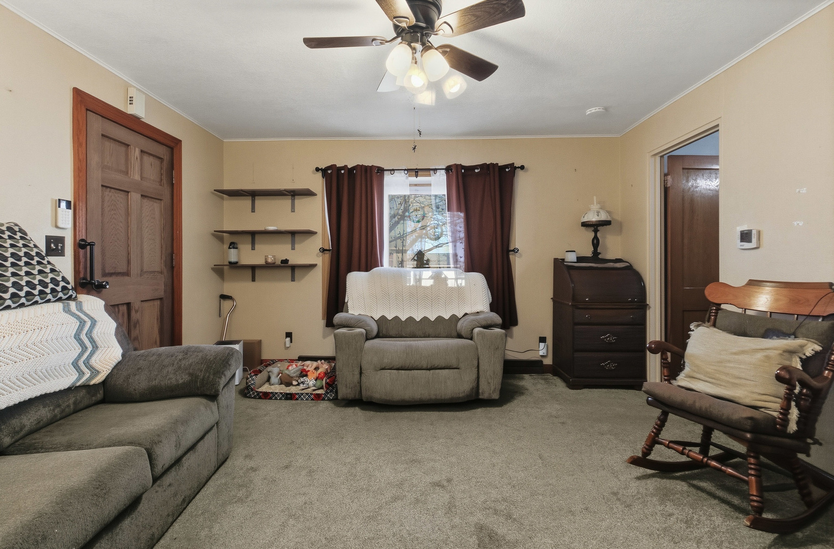 2400 47th Street Moline, IL 61265 - Photo 3 of 23 a living room with furniture and a chandelier