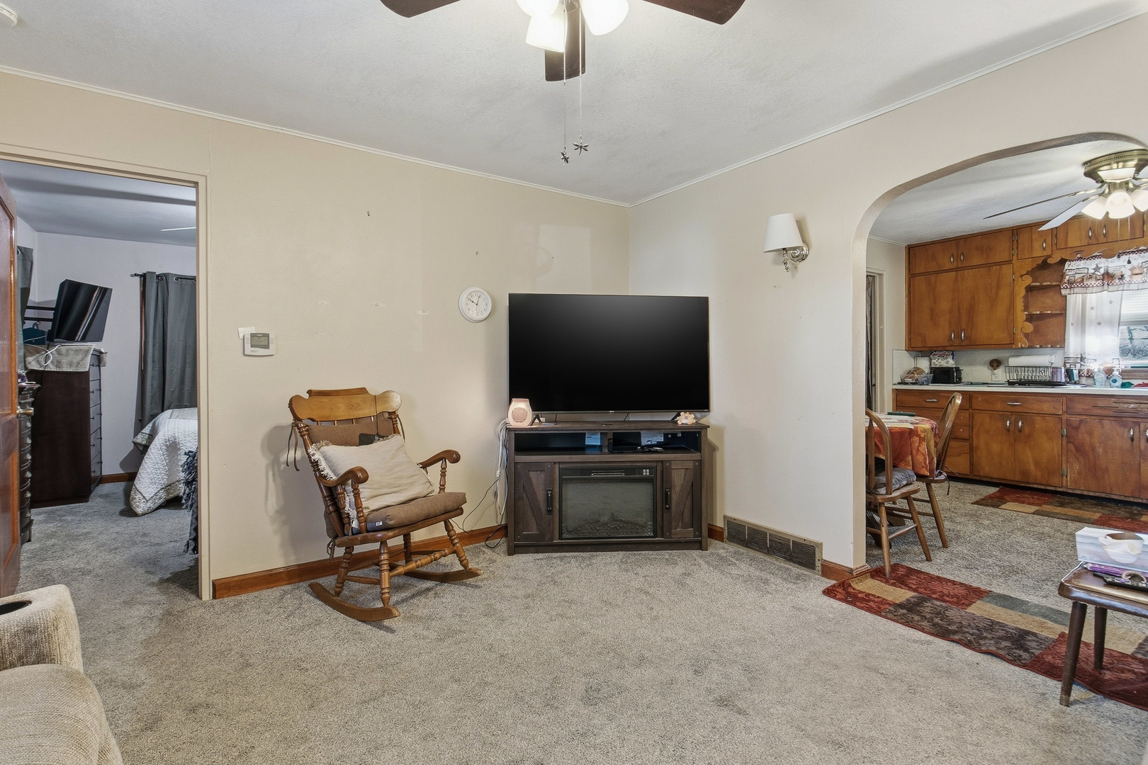 2400 47th Street Moline, IL 61265 - Photo 4 of 23 a living room with furniture and a flat screen tv