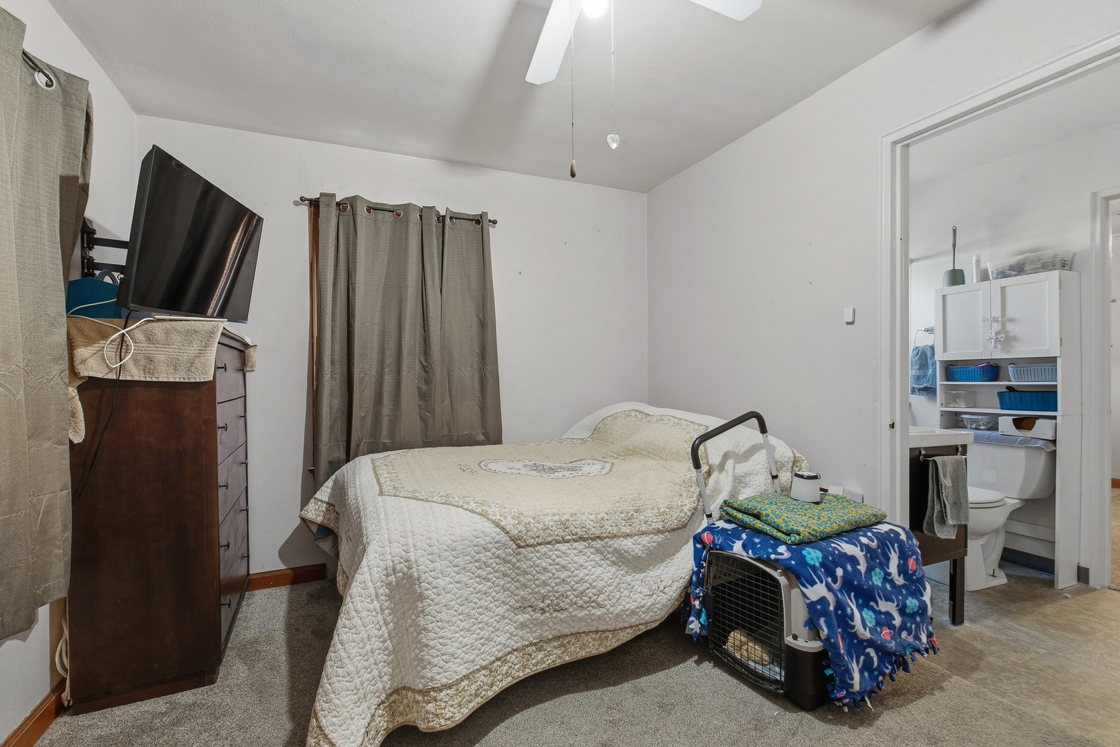 2400 47th Street Moline, IL 61265 - Photo 5 of 23 a living room with furniture a flat screen tv and a refrigerator