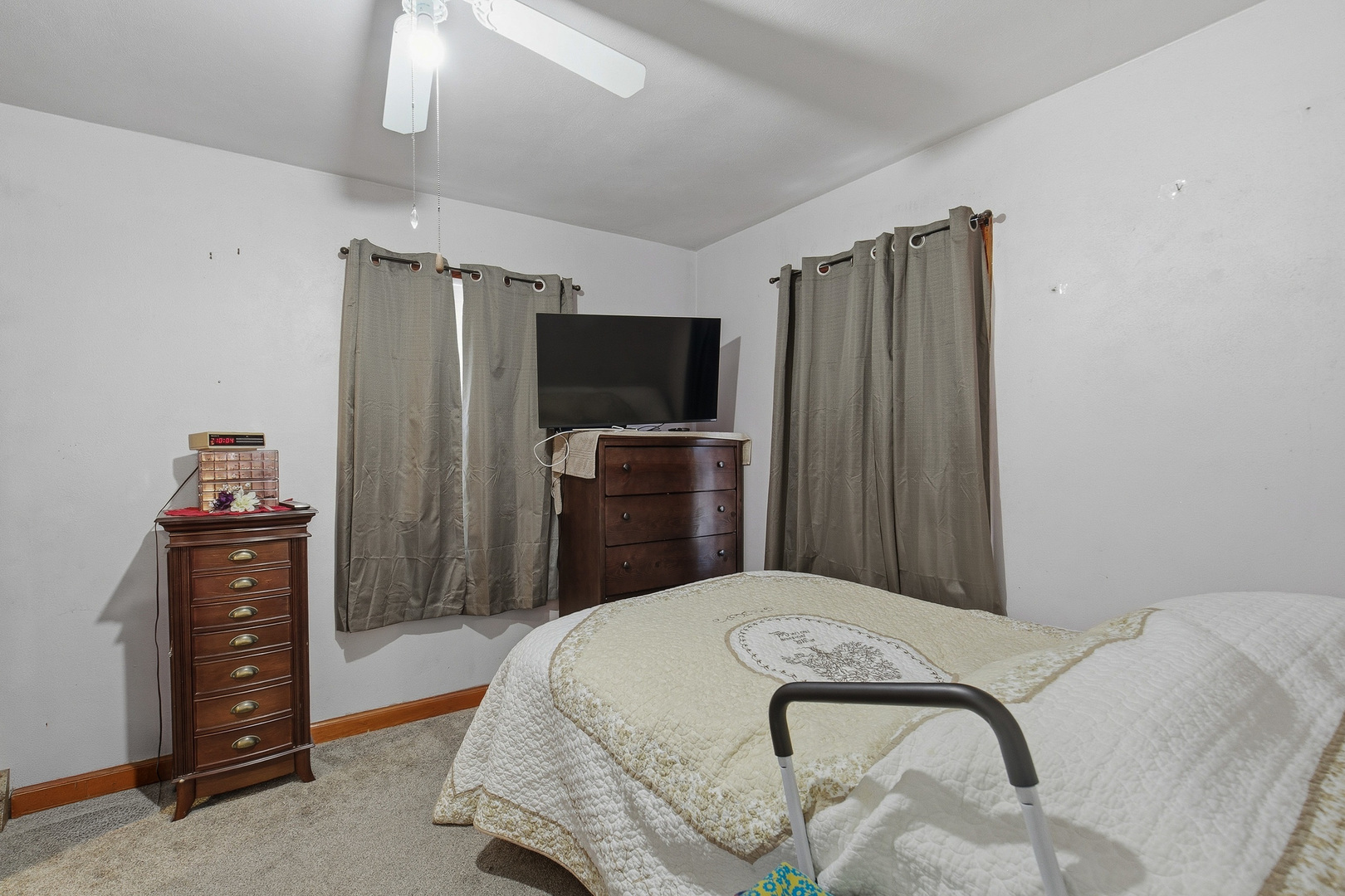 2400 47th Street Moline, IL 61265 - Photo 6 of 23 a bedroom with a bed and a television