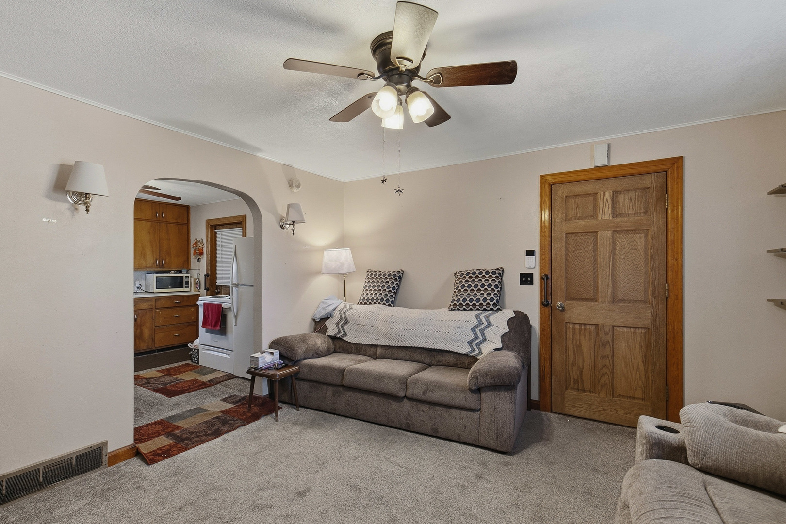2400 47th Street Moline, IL 61265 - Photo 8 of 23 a living room with furniture and a chandelier