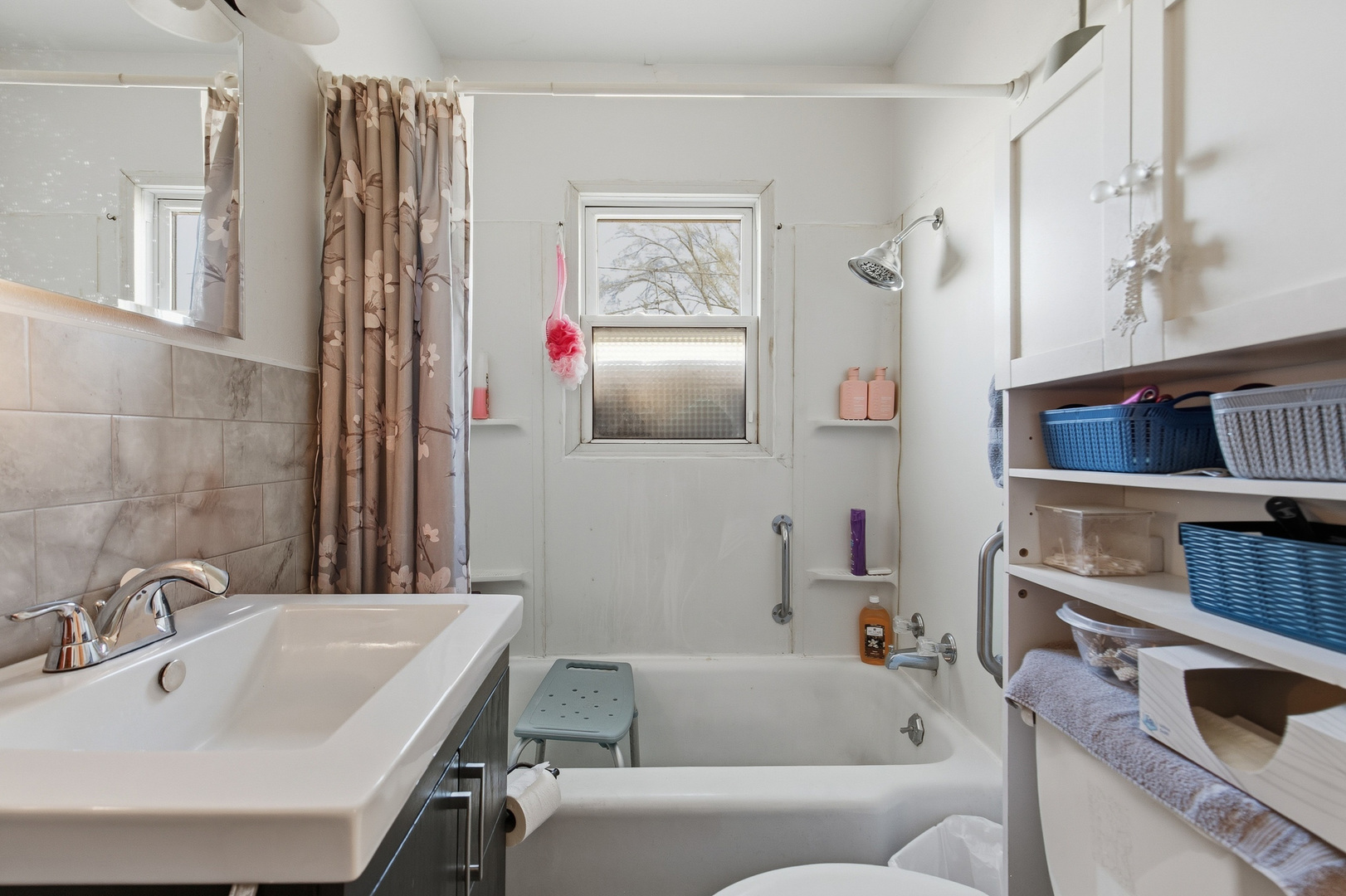 2400 47th Street Moline, IL 61265 - Photo 9 of 23 a bathroom with a sink and a bathtub