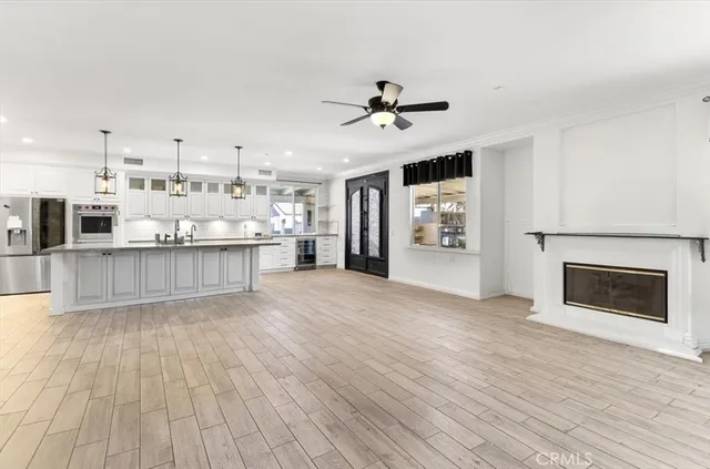 a bathroom with a granite countertop toilet sink mirror and vanity