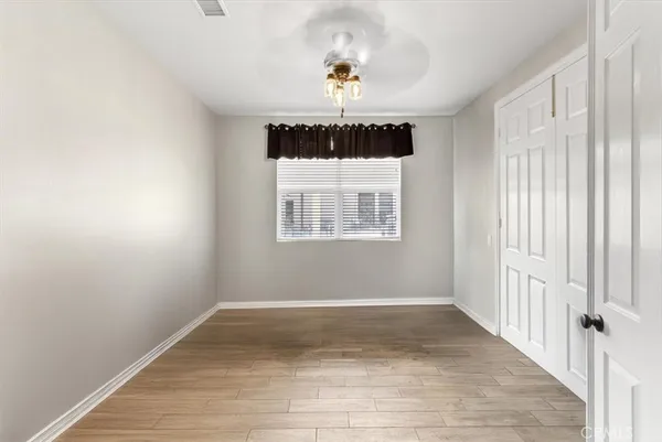 a spacious bathroom with a granite countertop sink mirror and shower