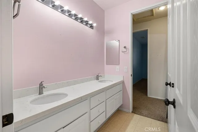 a bedroom with a large bed and large window