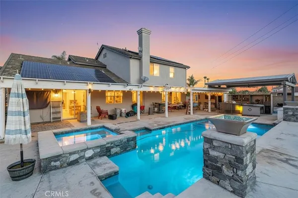 a view of a swimming pool with a patio