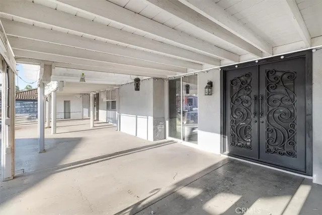 a view of swimming pool with outdoor seating and plants