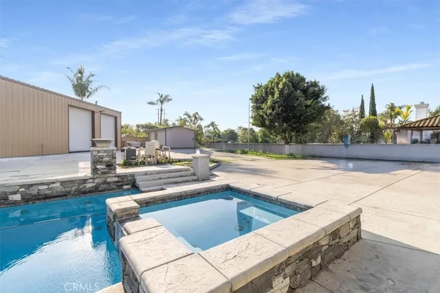 a view of a swimming pool with a patio