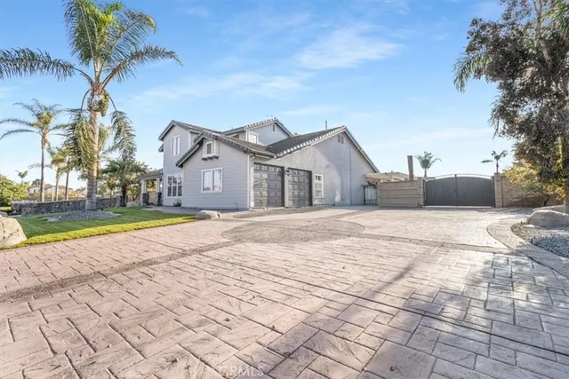 a view of house with yard and ocean view