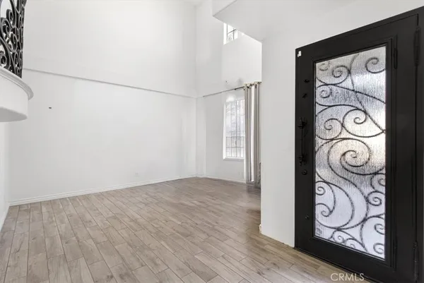 a view of an entryway with wooden floor