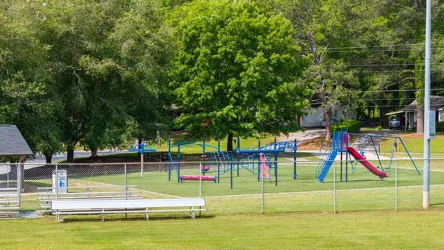 a view of swimming pool with sitting area