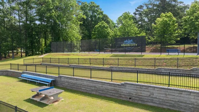 a view of a swimming pool with a chair and tables