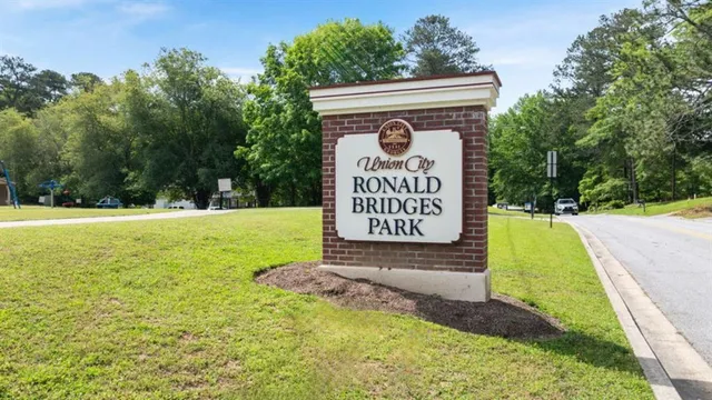 a view of a swimming pool with a yard