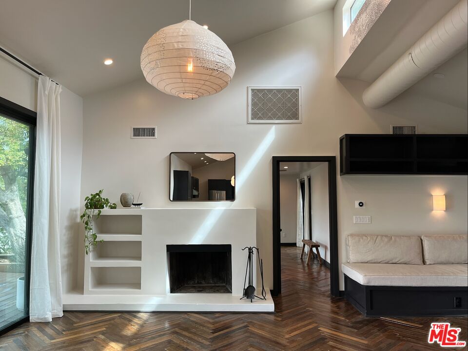 21273 Entrada Road Topanga, CA 90290 - Photo 11 of 70 a living room with furniture and a fireplace