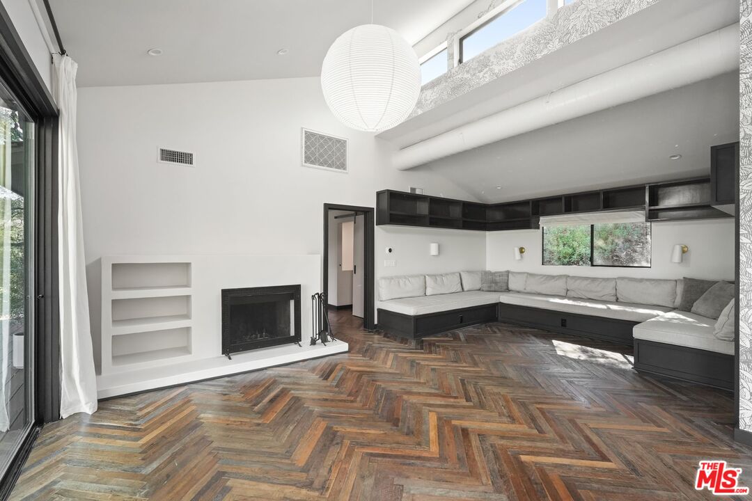21273 Entrada Road Topanga, CA 90290 - Photo 12 of 70 a living room with furniture and a fireplace