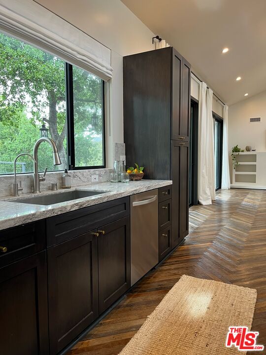 21273 Entrada Road Topanga, CA 90290 - Photo 24 of 70 a kitchen with stainless steel appliances granite countertop a sink stove and refrigerator