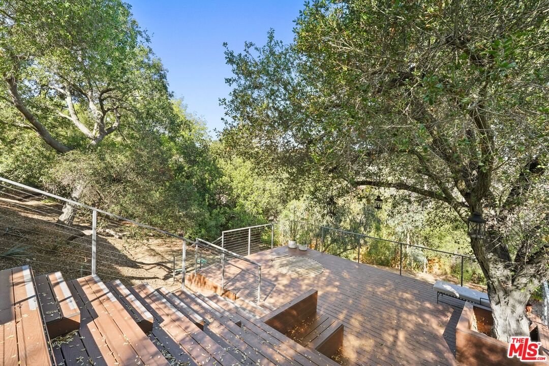 21273 Entrada Road Topanga, CA 90290 - Photo 29 of 70 a view of a yard with plants and large trees
