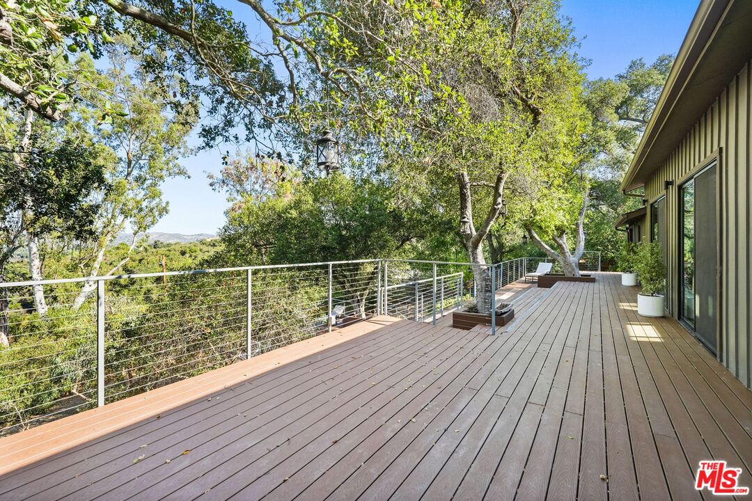 21273 Entrada Road Topanga, CA 90290 - Photo 3 of 70 a view of balcony with wooden floor and fence