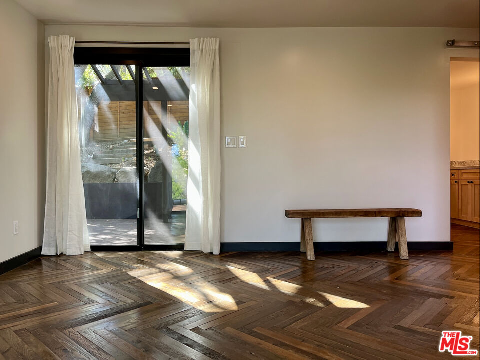 21273 Entrada Road Topanga, CA 90290 - Photo 33 of 70 a view of an empty room with wooden floor and a window