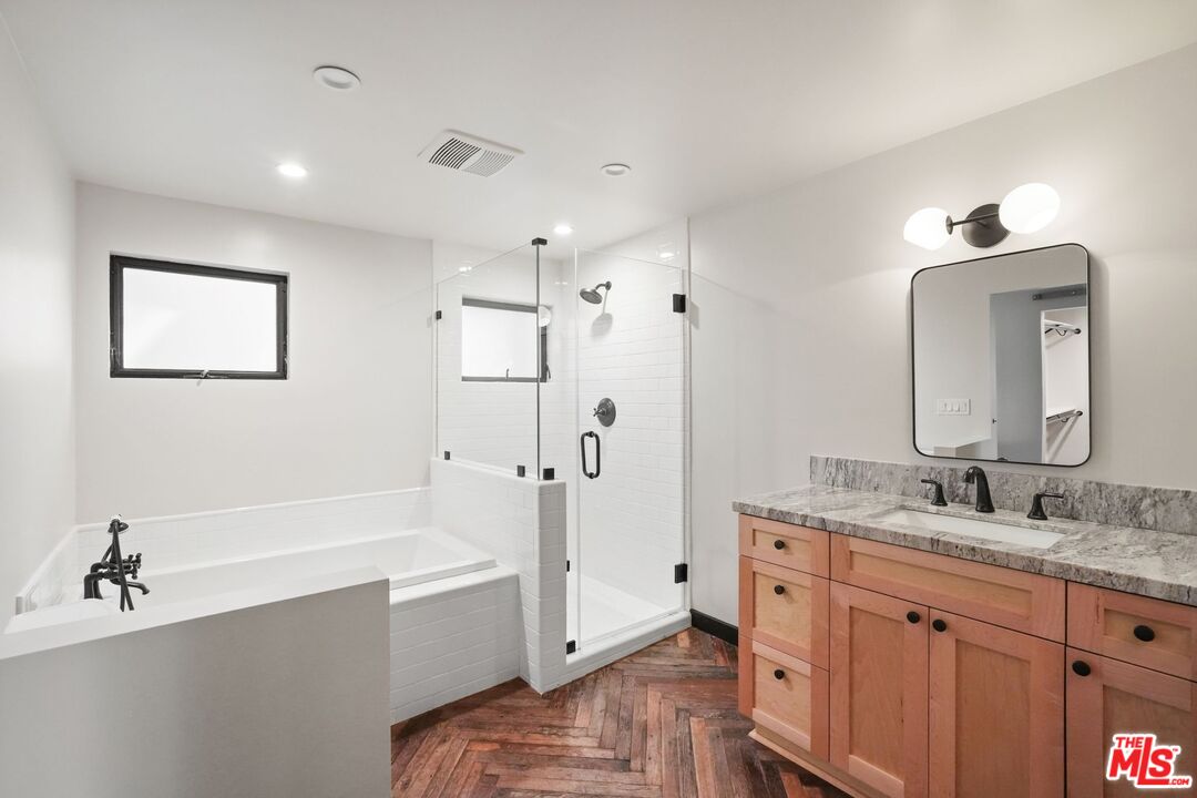 21273 Entrada Road Topanga, CA 90290 - Photo 35 of 70 a spacious bathroom with a tub sink and mirror