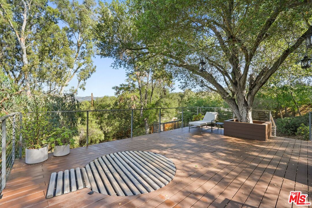 21273 Entrada Road Topanga, CA 90290 - Photo 43 of 70 a view of a backyard with a bench